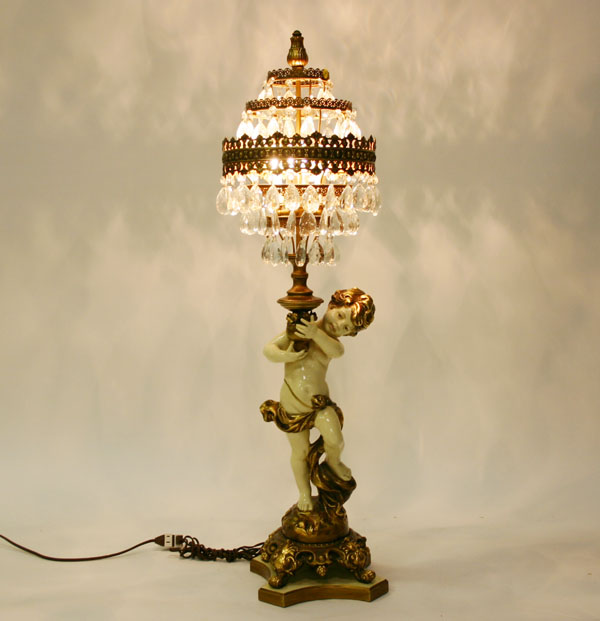 Cast metal cupid figure boudoir lamp five concentric tiers with