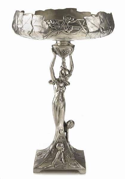 An Art Nouveau pewter figural compote designed by Achille Gamba