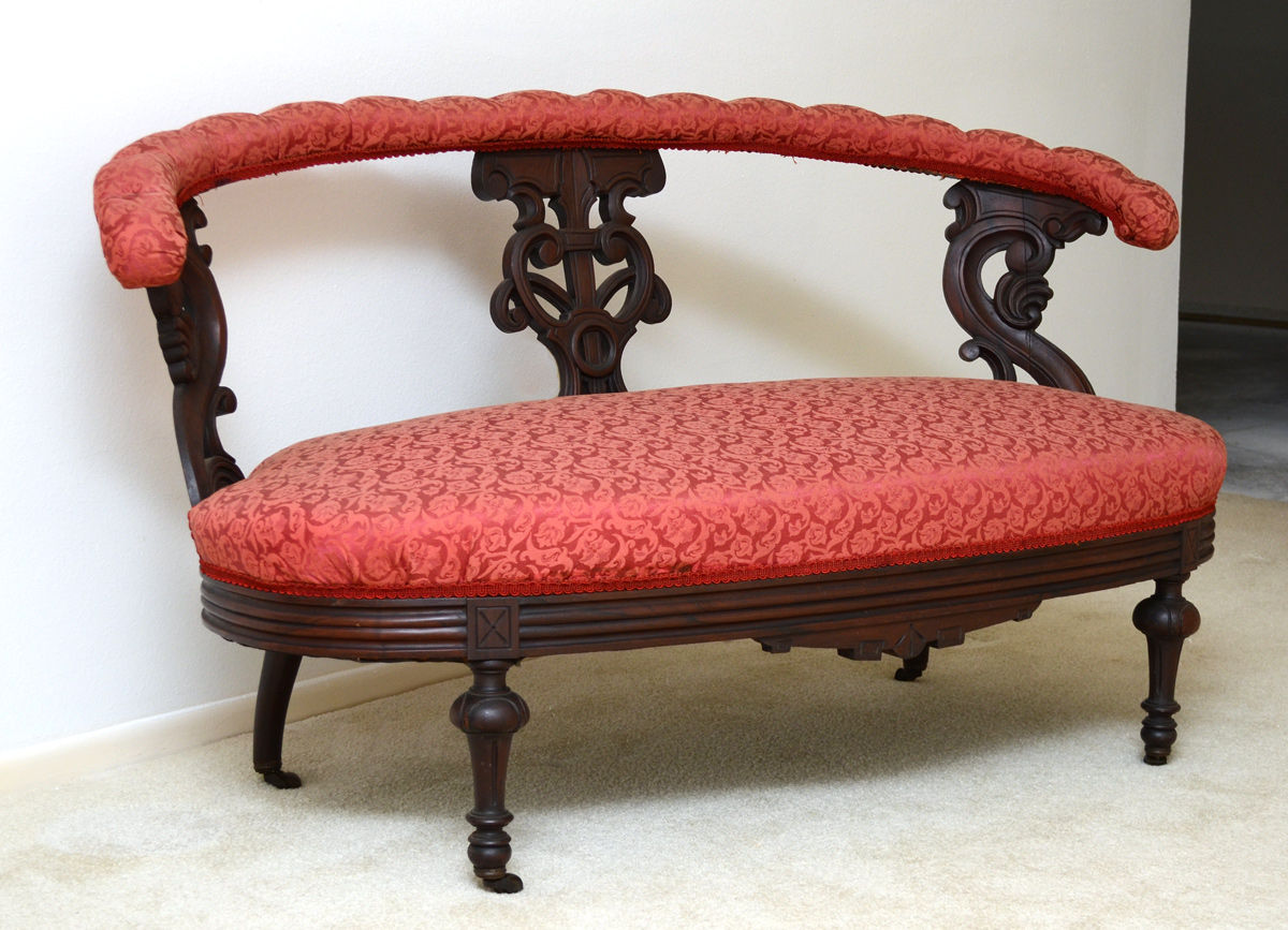 CARVED VICTORIAN LOVESEAT Padded and tufted top rail Carved and