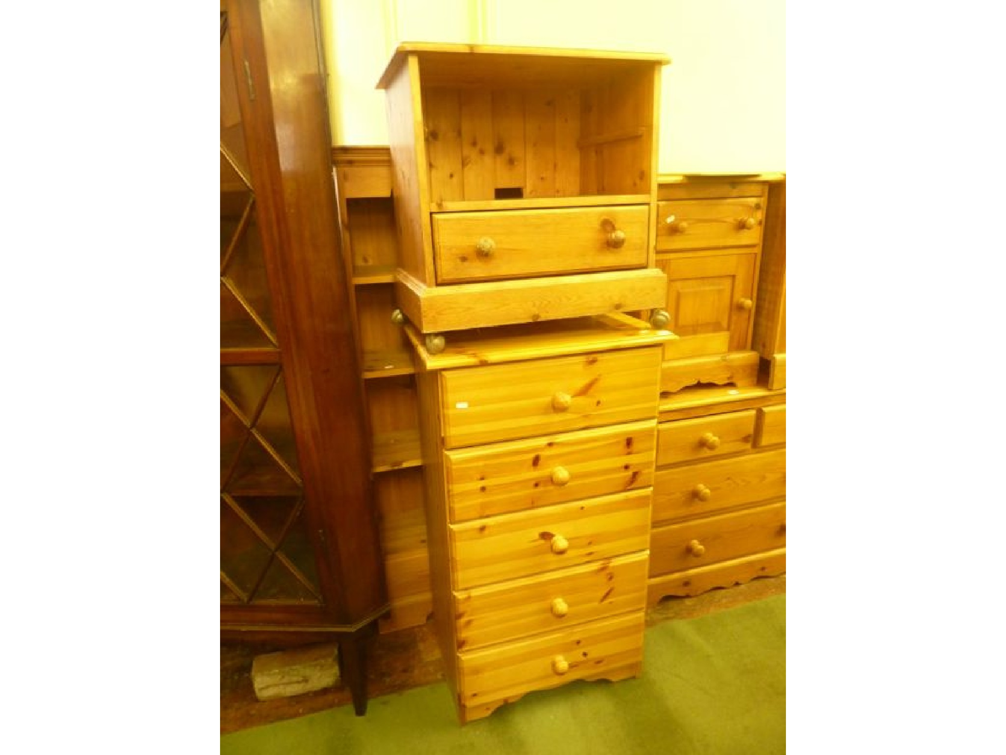 A contemporary solid pine freestanding open bookcase with three fixed