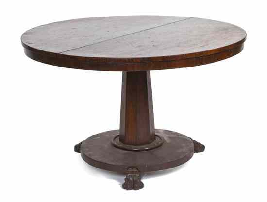 A Continental Rosewood Center Table having a circular top over