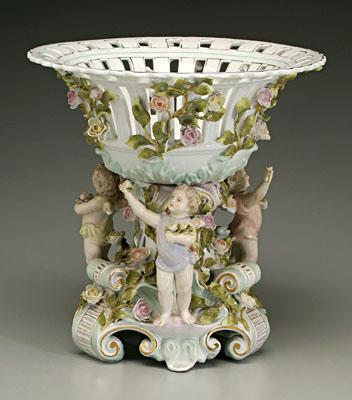 Figural porcelain center bowl heavily encrusted with vines and flowers