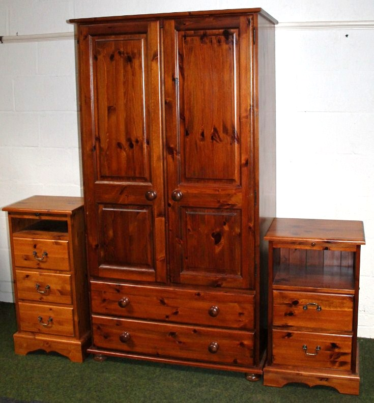 A modern matched pine two pieced bedroom suite comprising wardrobe