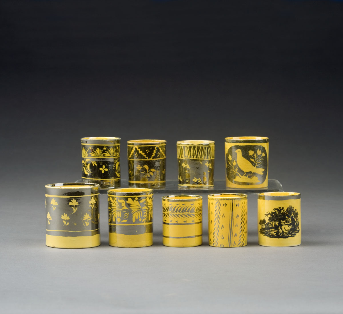 EIGHT ENGLISH YELLOW GLAZED SILVER RESIST CHILDREN S MUGS CIRCA