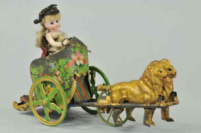 LION DRAWN CHARIOT Early toy depicts girl standing in chariot