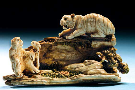 CARVED FOSSIL IVORY GROUP Well carved fossil mammoth ivory group