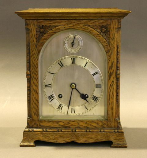 A French Art Deco mantle clock and Tazza garniture by