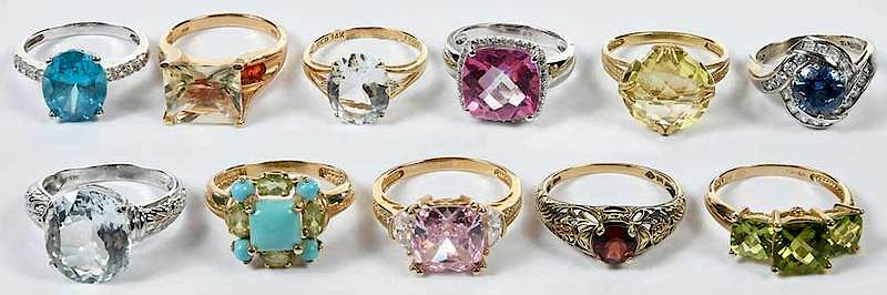 11 Gold Rings one ring with round fancy cut citrine