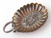 A Georgian silver oval ribbed caddy spoon with filigree centre