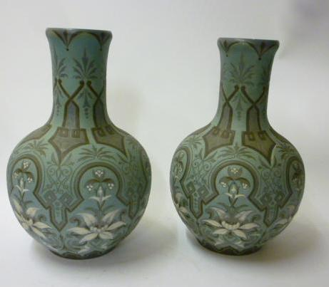 A WILLIAM MOORCROFT POTTERY VASE of waisted cylindrical form tubelined