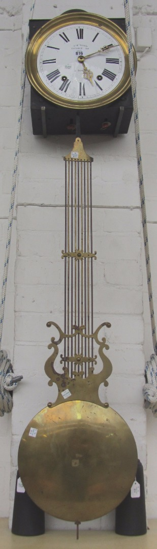 A French wall clock 19th century the white enamel dial