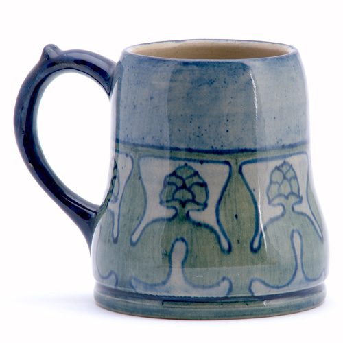 NEWCOMB COLLEGE Early mug painted by unidentified artist with stylized