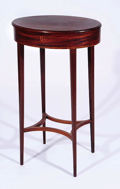 A 19TH CENTURY MAHOGANY OVAL WORK TABLE with sliding top