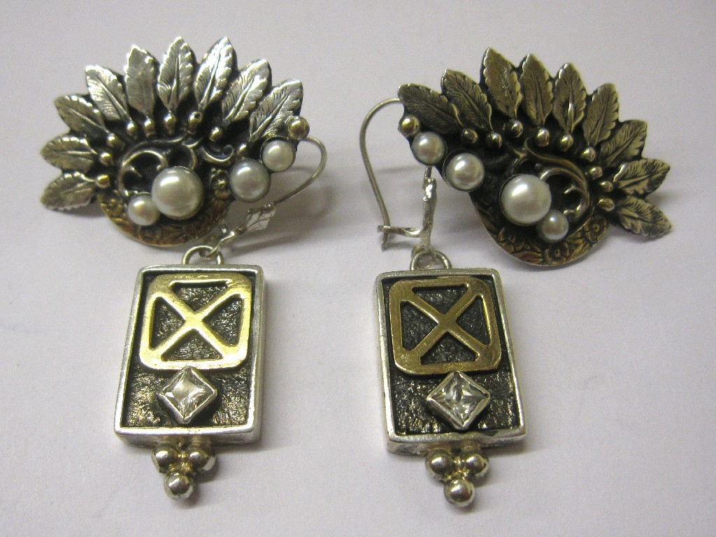 Leaf decorated silver and gold cultured peal set earrings and