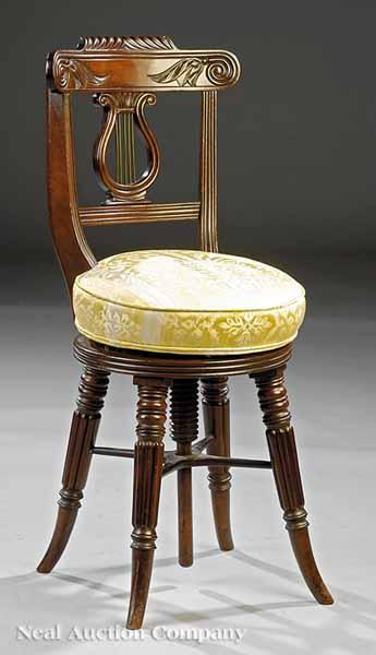 A Regency Piano Chair c 1810 probably English shaped crest
