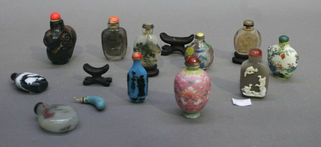 Twelve Chinese snuff bottles including petrified wood agate painted and
