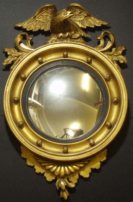 A Regency style circular convex mirror the circular plate with