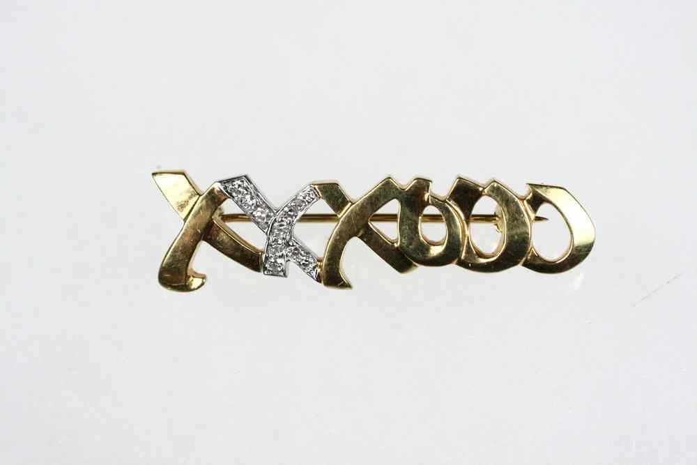 BROOCH Bar form brooch with X s and O s