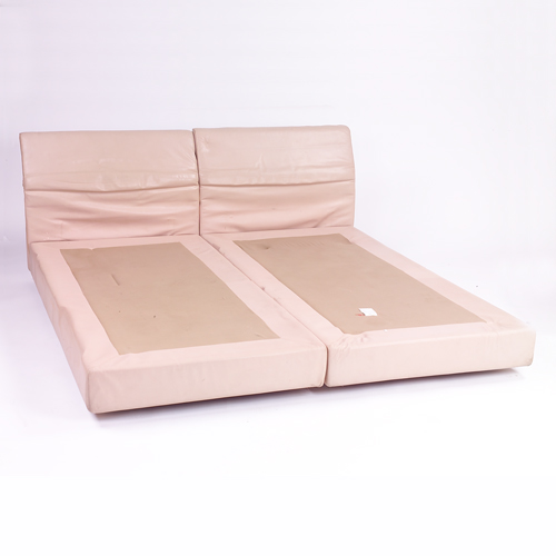 Saporiti king size bed upholstered in light tan leather with