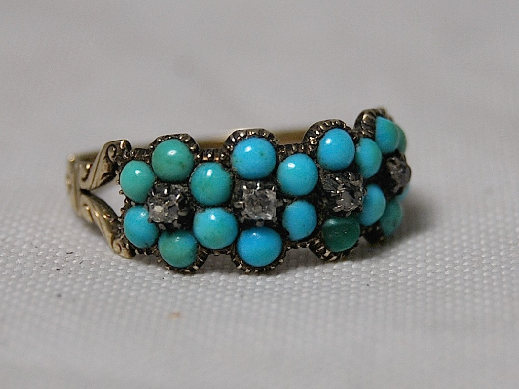 Victorian turquoise set flower ring with four small diamonds in