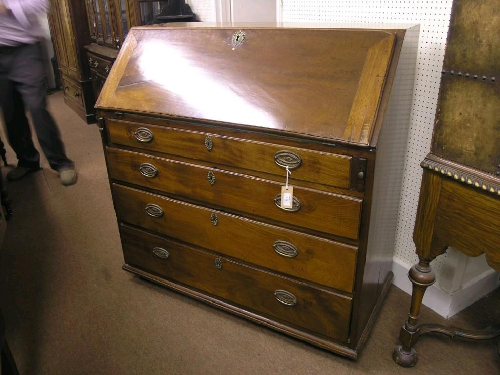 A George III Cuban mahogany bureau fall front enclosing an