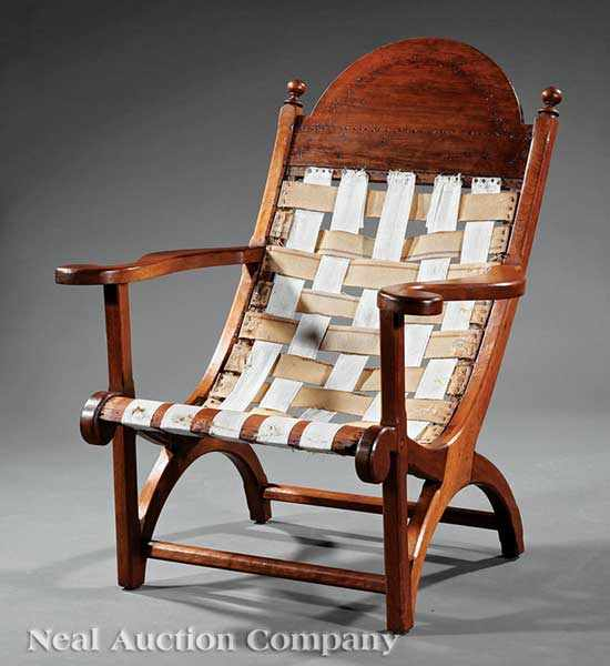 A Southern Walnut Campeachy Chair early 19th c arched crest