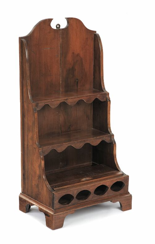 A miniature pine waterfall bookcase with three graduated shelves on