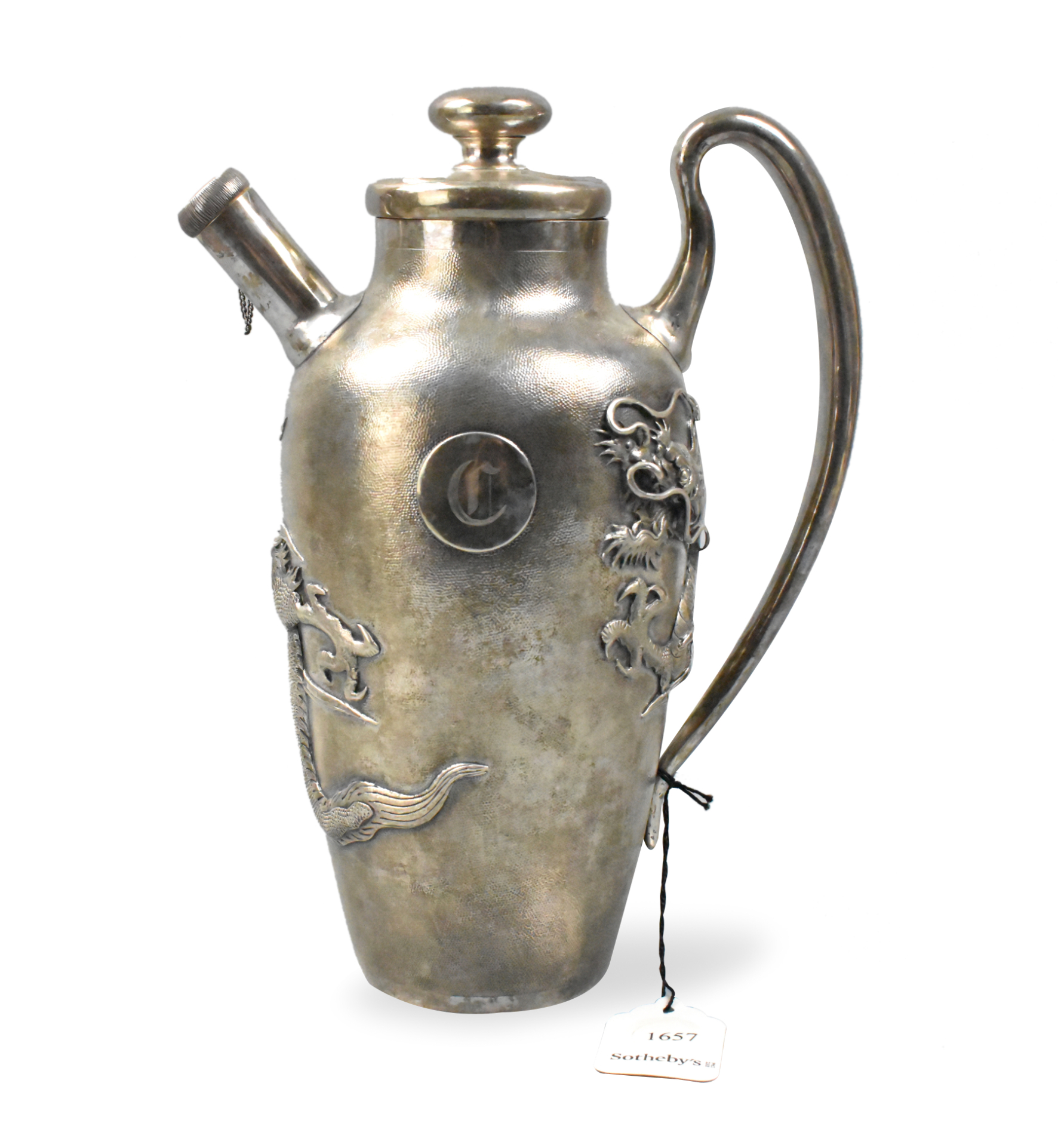 A Chinese sterling silver ewer with dragon design dating from