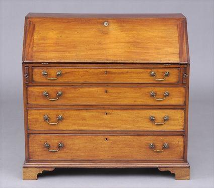 GEORGE III MAHOGANY SLANT FRONT DESK The flap opening to