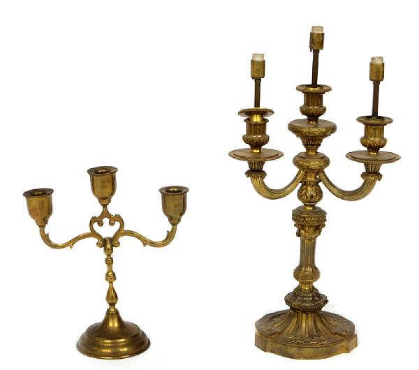 A pair of Louis XVI style gilt bronze three light
