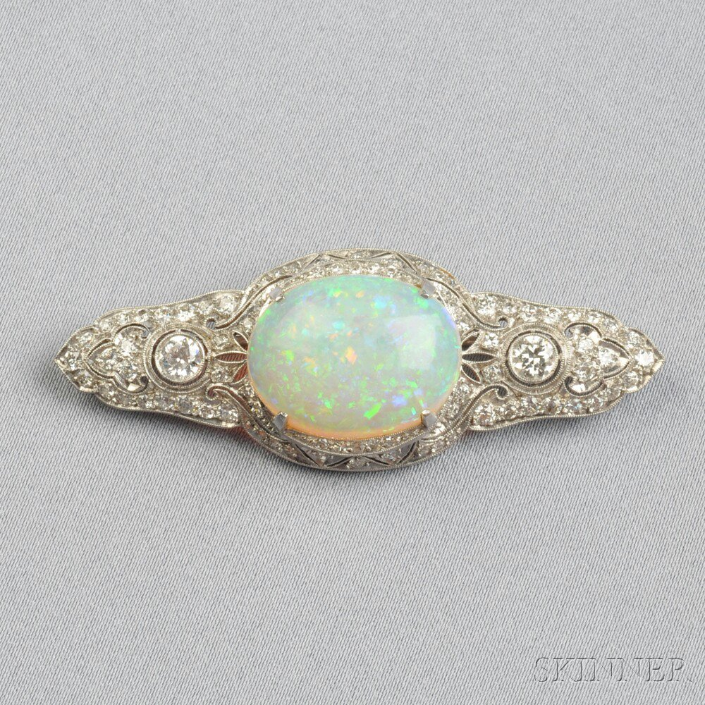 Platinum Opal and Diamond Brooch set with a cabochon opal