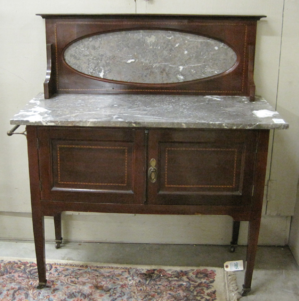 AN EDWARDIAN MARBLE TOP MAHOGANY WASHSTAND English c 1905 a