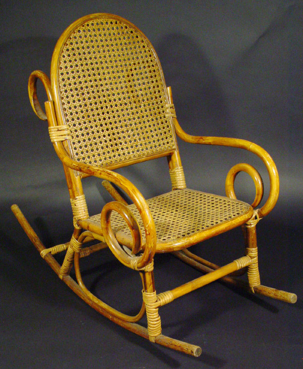 Bentwood child s rocking chair with cane back and seat
