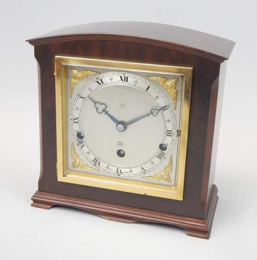 A 20thC Elliott mantel clock in a walnut case the