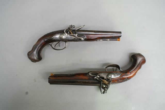 A pair of French double barrel flintlock pistols 55 caliber