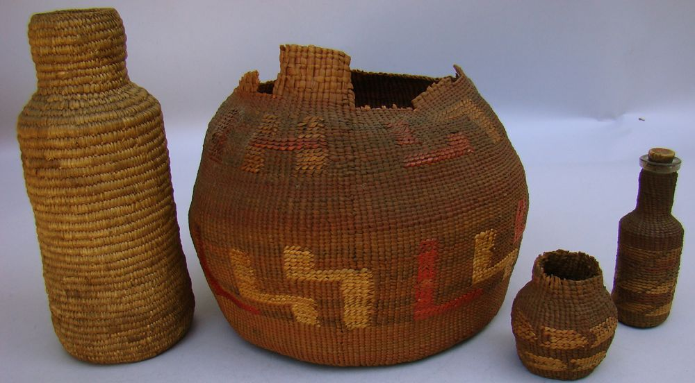 FOUR INUIT BASKETS 19th Century1 Basketry covered bottle form Height