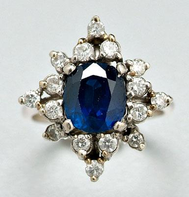 Sapphire and diamond ring one oval faceted medium to intense