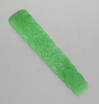 A Carved Jadeite Ornament Chinese A jadeite carved ornament depicting