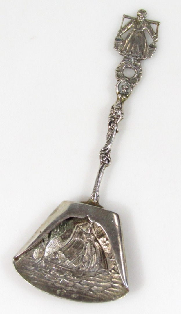 A Dutch caddy spoon with a part pierced floral stem
