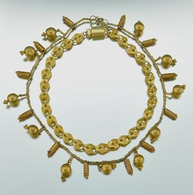 Two Interesting Necklaces An Ashanti style gilded necklace with globe