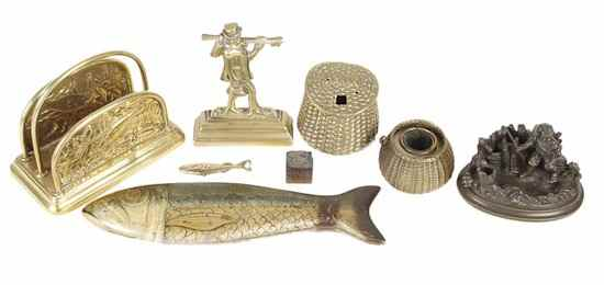 Fish related desktop items comprising a patinated brone match holder