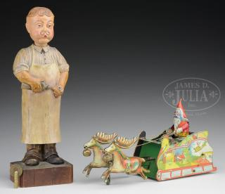 GERMAN CARVED WHISTLER FIGURE TOGETHER WITH SANTEE CLAUS SHEET TIN