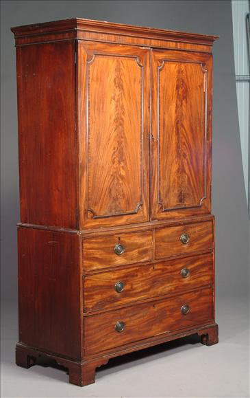 A George III mahogany clothes press circa 1800 the moulded
