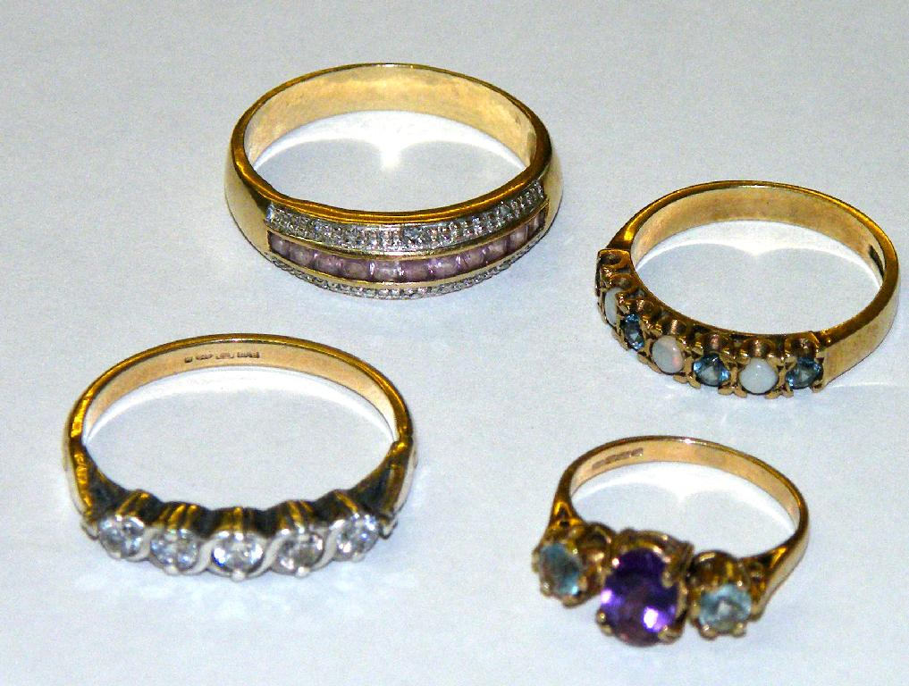 Four 9ct gem set rings