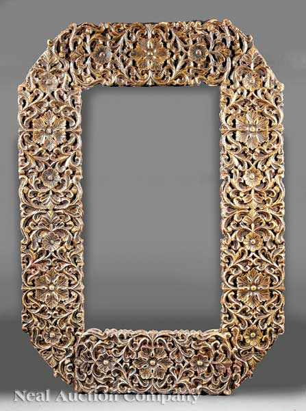 An Antique Middle Eastern Carved Mirror Frame highly carved foliate