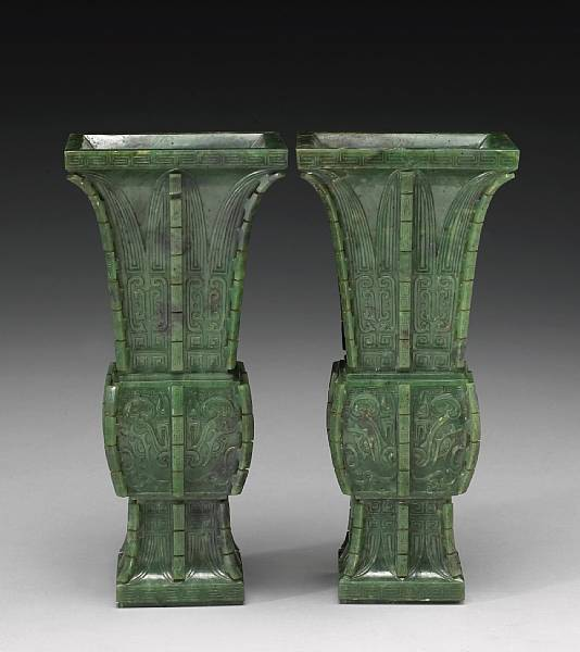 A pair of spinach jade gu form vases 18th Century
