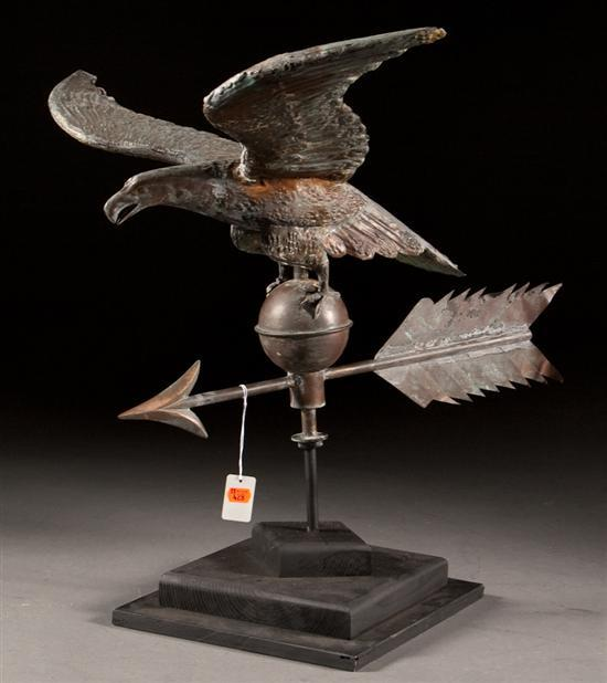American copper eagle form weather vane with ebonized wood stand