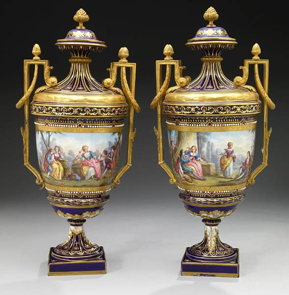 A pair of Sevres style jeweled porcelain covered vases late