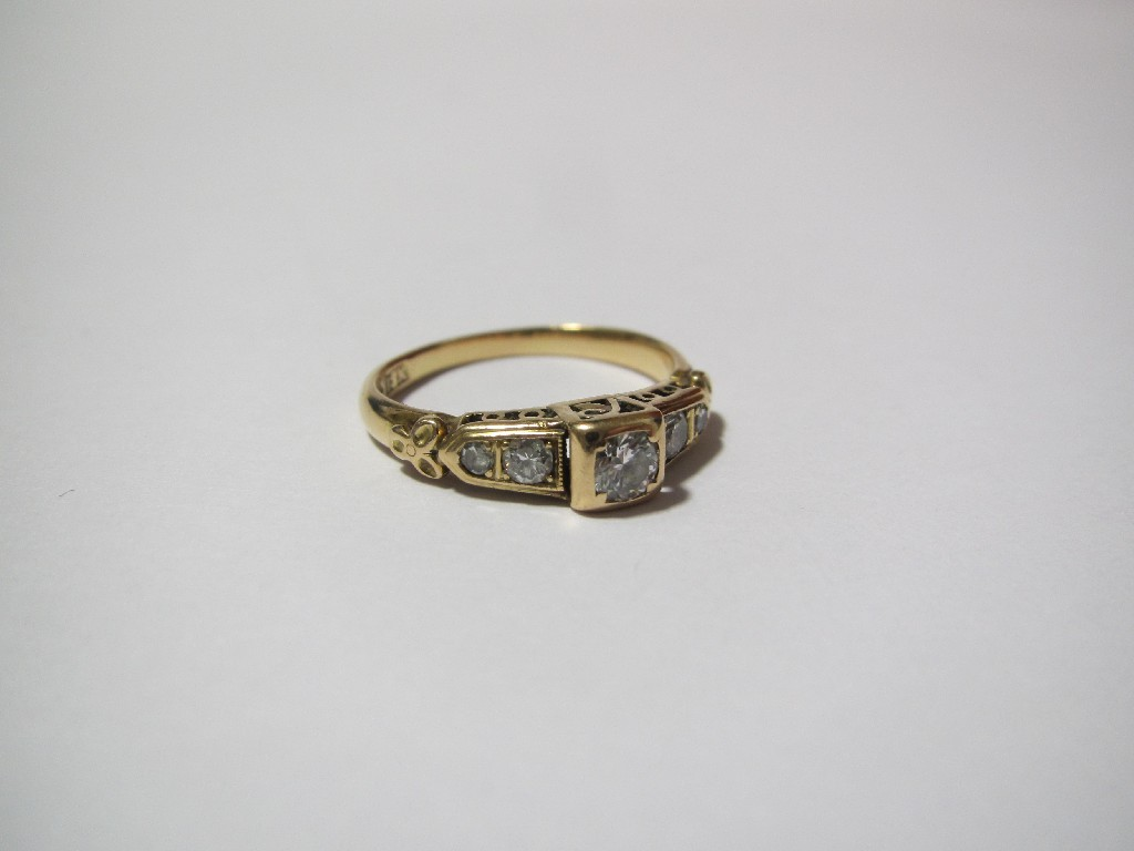 A diamond five stone ring centreing on a 20ct brilliant