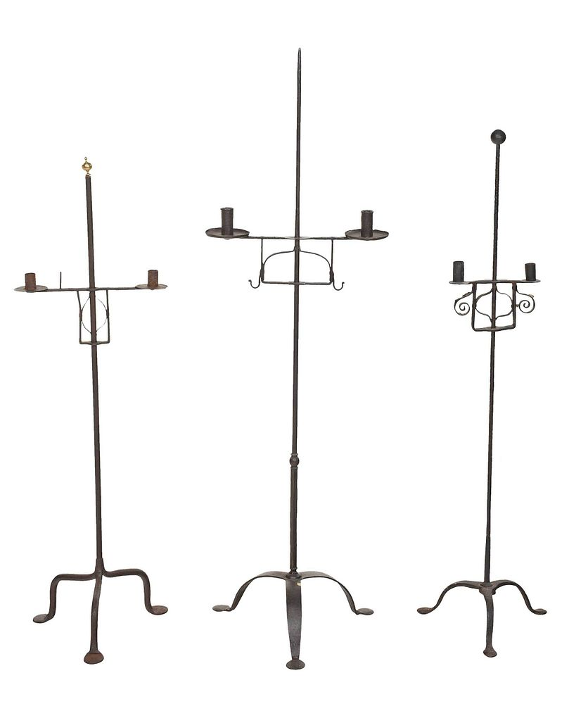 Group Three Wrought Iron Adjustable Candlestands probably 18th 19th century